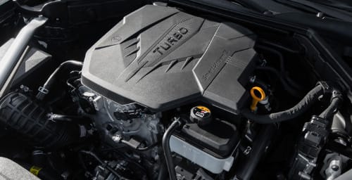 Zoomed in view of the turbocharged engine under the hood