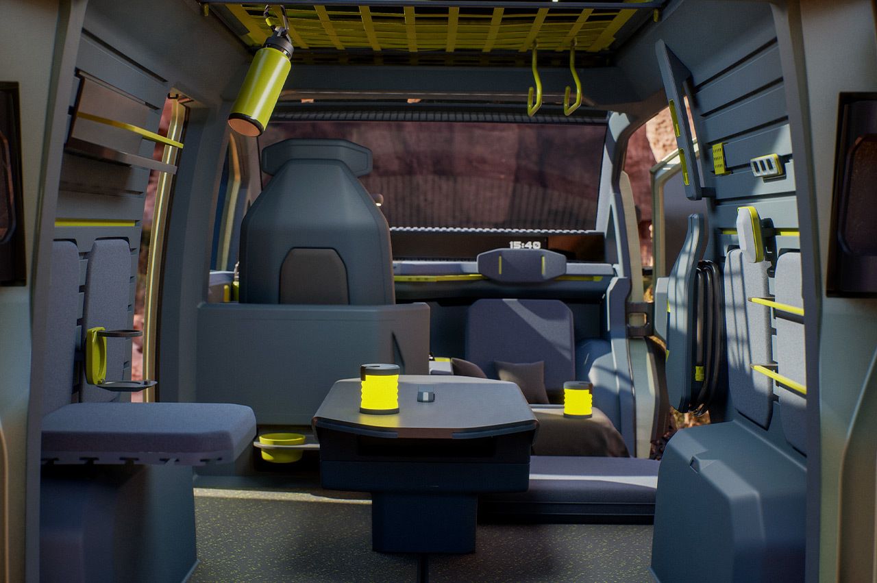 Kia "WKNDR" concept EV, vista completa del espacio interior flexible organizado para acomodar asientos alrededor de una pequeña mesa en el centro.