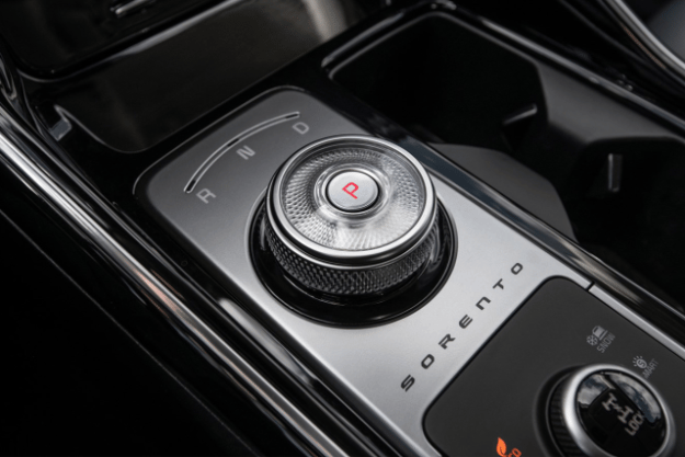  2025 Kia Sorento Hybrid interior view of the center console zoomed in on the dial gear shifter