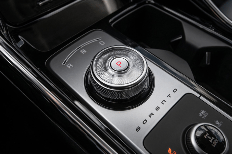  2025 Kia Sorento Hybrid interior view of the center console zoomed in on the dial gear shifter